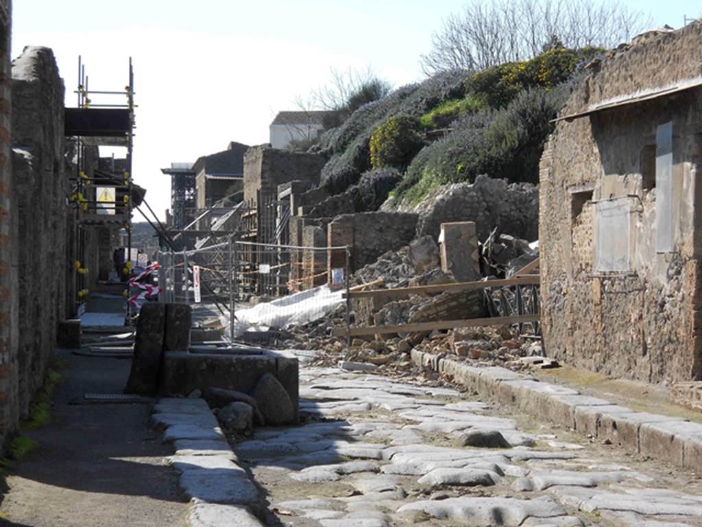 III.3.6 Pompeii. February 2011, looking west along Via dell�Abbondanza to III.4.1 and III.3.6. Photo courtesy of Guy de la Bedoyere.