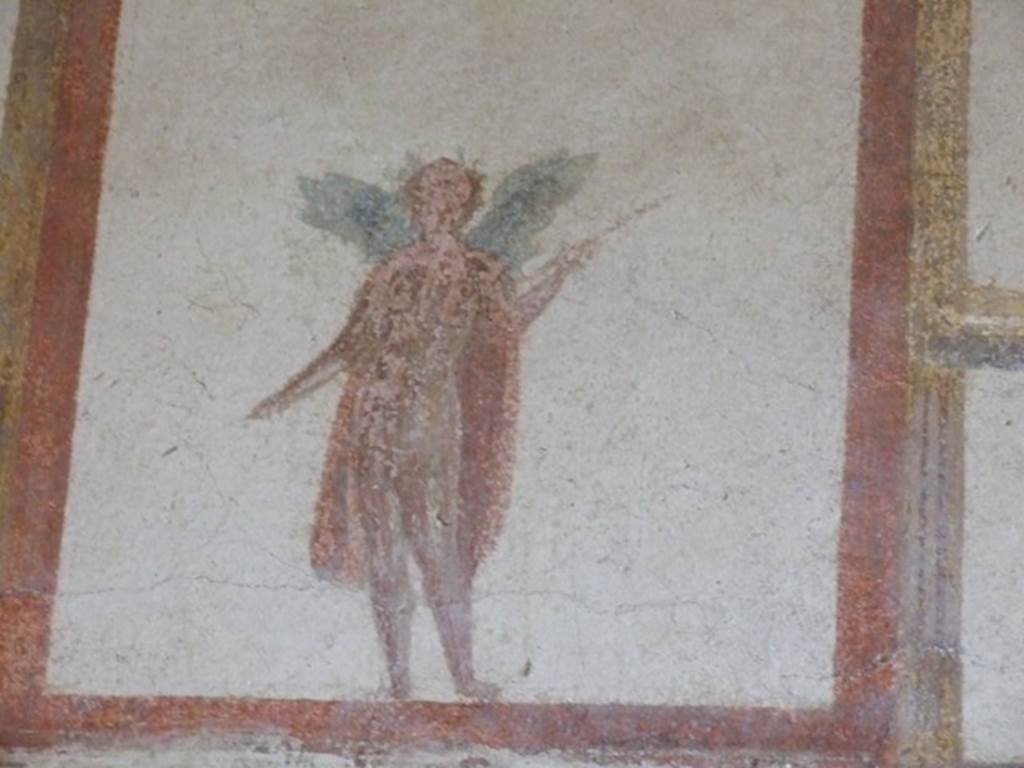 III.4.b Pompeii. March 2009. Room 4. Exedra. Upper east wall. Painting of winged figure wearing a crown and holding a spear.