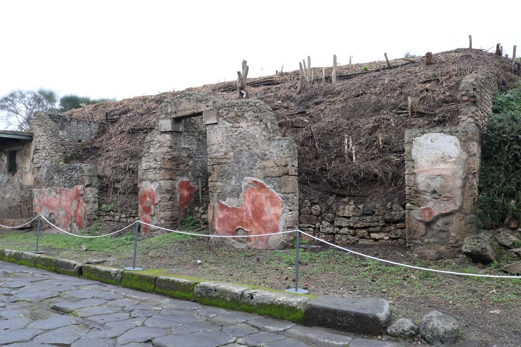 III.5.5 Pompeii, on right. December 2018. 
Looking west towards entrance doorways on north side of Via dell�Abbondanza, with III.5.3, on left. Photo courtesy of Aude Durand.
