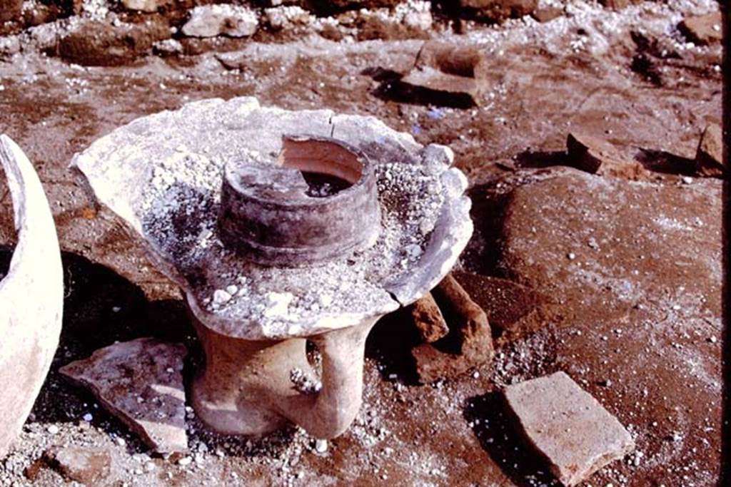 III.7 Pompeii. 1976. Top part of large amphora, used as a brazier, and now free of the lapilli. Photo by Stanley A. Jashemski.   
Source: The Wilhelmina and Stanley A. Jashemski archive in the University of Maryland Library, Special Collections (See collection page) and made available under the Creative Commons Attribution-Non Commercial License v.4. See Licence and use details. J76f0448
