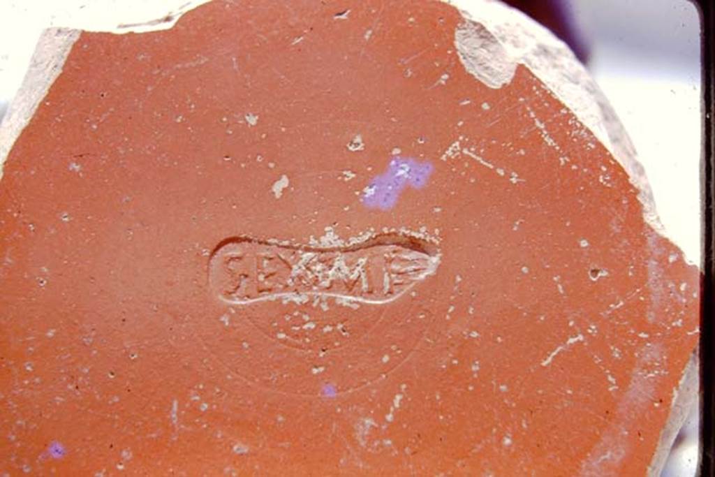 III.7 Pompeii. 1975. Detail of stamp on fragment of Arretine ware. Photo by Stanley A. Jashemski.   
Source: The Wilhelmina and Stanley A. Jashemski archive in the University of Maryland Library, Special Collections (See collection page) and made available under the Creative Commons Attribution-Non Commercial License v.4. See Licence and use details. J75f0729
