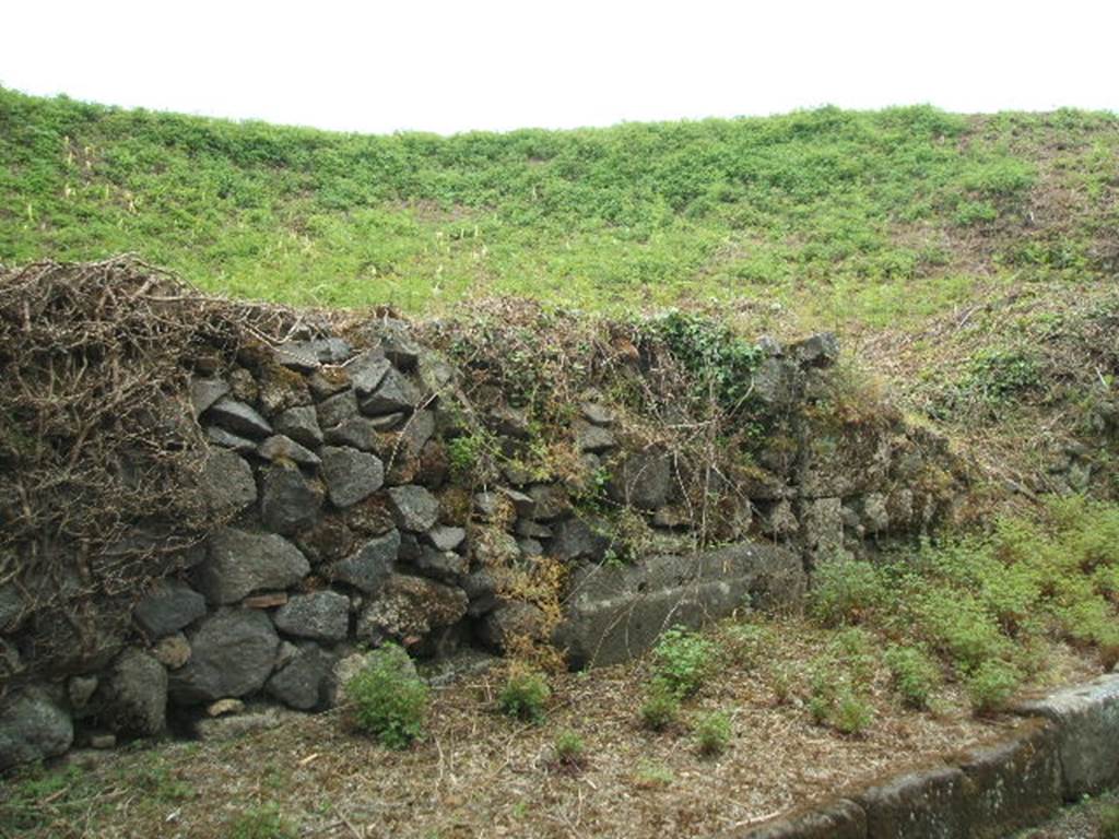 III.10.1 Pompeii.  May 2005.  Front wall on Via Nola.
 
It is difficult to reconcile the entrances in this insula with the plans as the entrances onto Via Nola have been filled in or are unexcavated.
