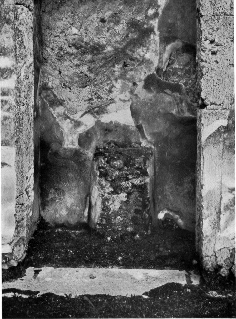 V.1.7 Pompeii. 1930s? Room 5, looking south towards round altar with paintings of serpents on either side.
See Boyce G. K., 1937. Corpus of the Lararia of Pompeii. Rome: MAAR 14. (p. 32, pl. 39,4)
