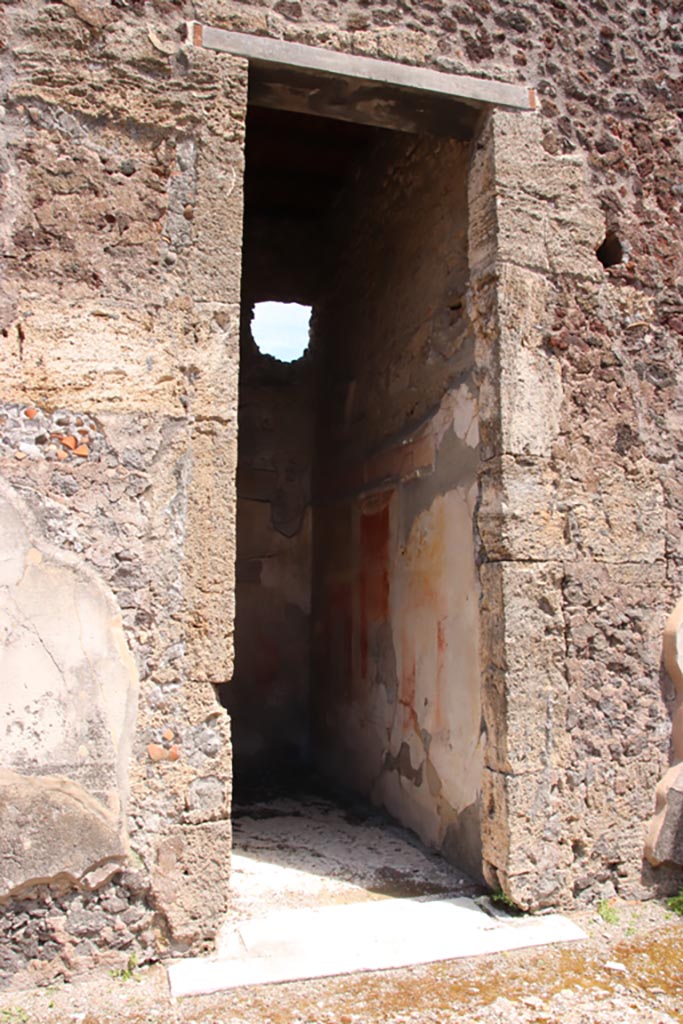 V.1.7 Pompeii. May 2024.
Doorway to room 7, on east side of atrium. Photo courtesy of Klaus Heese.