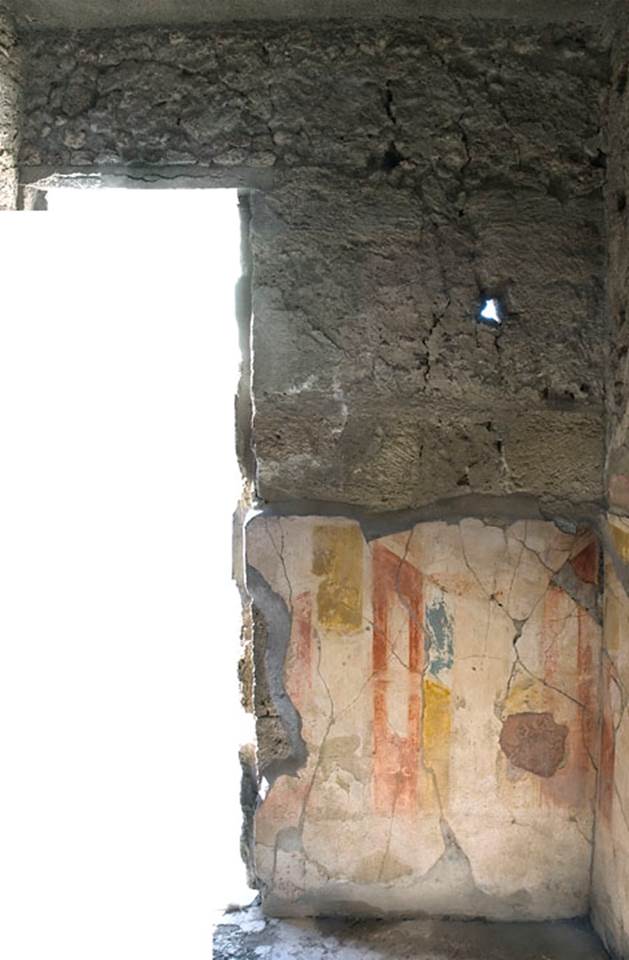 V.1.7 Pompeii. c.2005-7.
Room 7, west wall on north side of doorway to atrium. Photo by Thomas Staub.
Photo courtesy of the Swedish Pompeii Project.