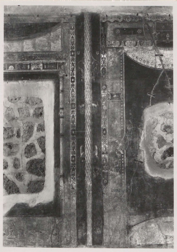 V.1.26 Pompeii. 1931. Room "i", detail from the north wall.
According to Warscher –
“The holes remain after the paintings have been transferred to the Museum.
The ornaments left in situ deserve attention because they are among the finest of the Third style.
As for the side panels – you can clearly see that they represented curtains.
As far as I know this is the only example of the Third style where curtains are represented.
If it were not for this example so characteristic of the Third style, (just look at the ornaments!), I would have said that the curtains are found only in the Fourth style, but this example prevents me from doing this generalization.
See Warscher, T. 1942. Catalogo illustrato degli affreschi del Museo Nazionale di Napoli. Sala LXXIX. Vol.1. Rome, Swedish Institute
DAIR 31.1748. Photo © Deutsches Archäologisches Institut, Abteilung Rom, Arkiv. 
(I buchi rimasti dopo che le pitture sono state trasferite nel Museo. 
Gli ornamenti rimasti in situ meritano attenzione perche sono fra i piu fini del terzo stile. 
Quanto ai pannelli laterali – si vede chiaramente che rappresentavano delle cortine. 
Per quanto io sappia questo era l’unico esempio del terzo stile dove sono rappresentate cortine. 
Se non fosse questo esempio cosi caratteristico del terzo stile, (basta vedere gli ornamenti!), io avrei detto che le cortine si riscontrano solamente nel quarto stile, ma proprio questo esempio mi impedisce di fare questa generalizzazione.)
