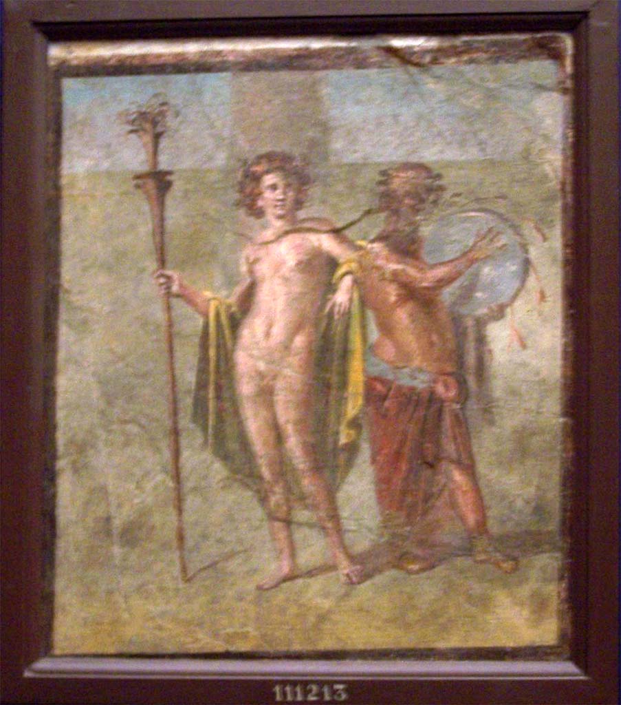 V.1.26 Pompeii. Room “t”, north wall. Painting of Hermaphrodite with Silenus playing a drum.
Now in Naples Archaeological Museum. Inventory number 111213.