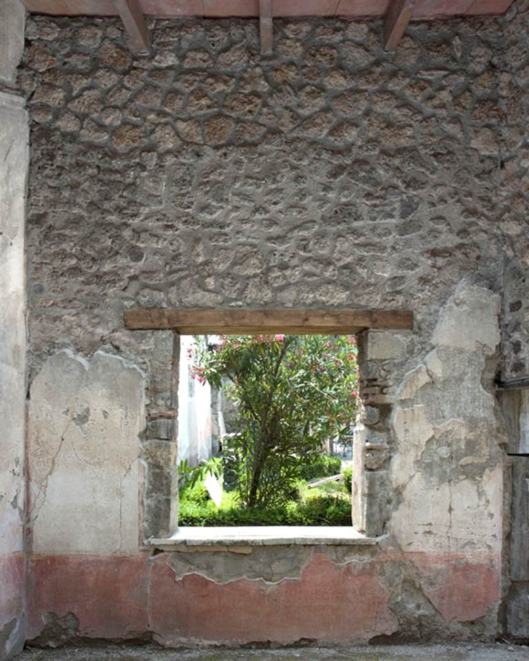V.1.26 Pompeii. 2012. Room “t”, west wall with window overlooking peristyle.
“Restored parts of the wall photographed and merge with the lower part and floor line of earlier photos of 2005-07.”
Photo by Hans Thorwid.
Photo and words courtesy of The Swedish Pompeii Project.