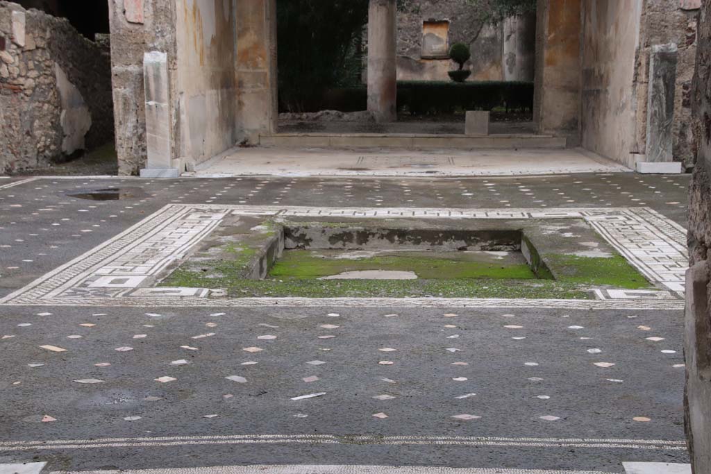 V.1.26 Pompeii. October 2020. Room “b”, looking east across flooring in atrium, towards impluvium. Photo courtesy of Klaus Heese.se.