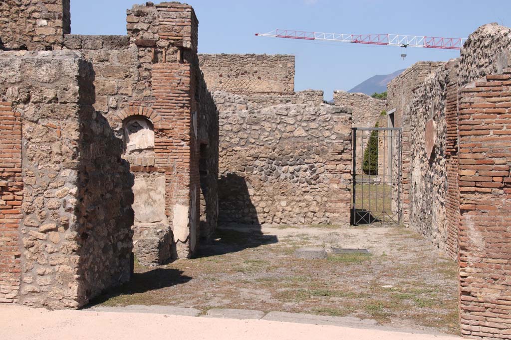 V.2.1 Pompeii. September 2021. Entrance through a shop-room on north side of Via di Nola. Photo courtesy of Klaus Heese.
