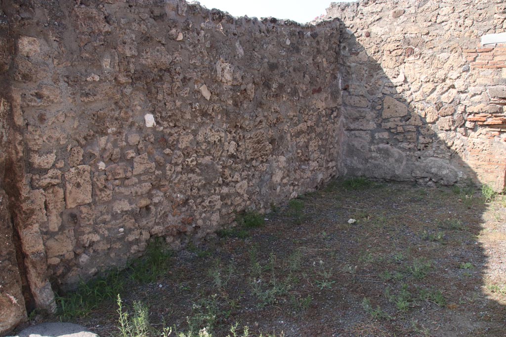 V.2.8 Pompeii. October 2023. Looking north along west wall of shop-room. Photo courtesy of Klaus Heese.