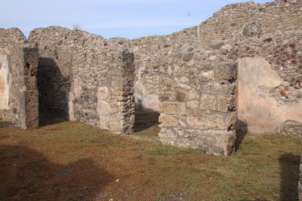 V.2.10 Pompeii. October 2022. East side of atrium looking at doorways to rooms 4, 5 and 6. Photo courtesy of Klaus Heese.
