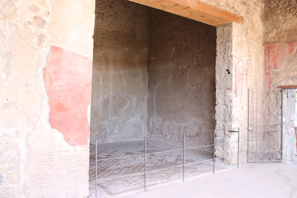 V.2.i Pompeii. October 2023. Room 24, in north-east corner of peristyle, looking from north portico. Photo courtesy of Klaus Heese.