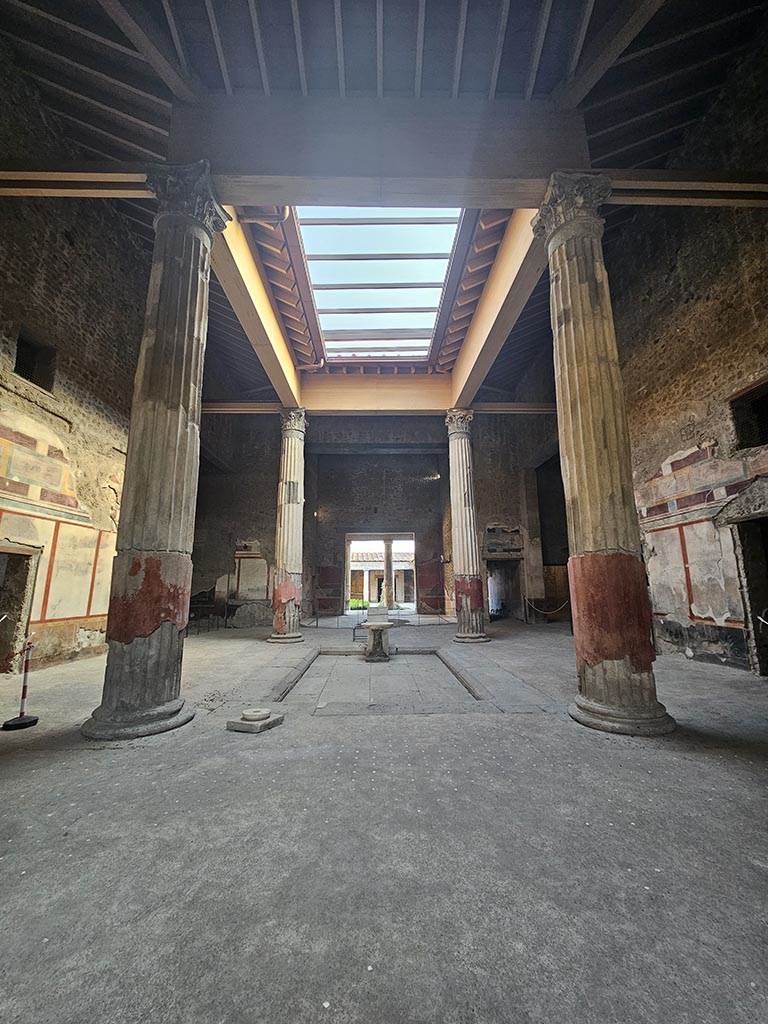 V.2.i Pompeii. November 2024.
Room 1, atrium and impluvium looking south towards tablinum and peristyle. Photo courtesy of Annette Haug.
