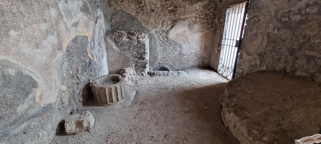 V.2.i Pompeii. December 2023. Room 11, looking towards south wall, with doorway to latrine, on right. Photo courtesy of Miriam Colomer.