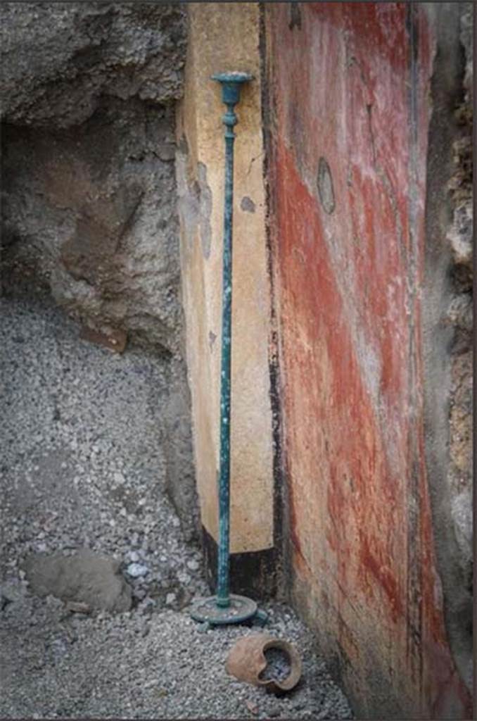 V.2.15 Pompeii. June 2018. Room A6 during 2018 excavations. 
Bronze candelabra and terracotta vase by east wall doorway. 
Photograph © Parco Archeologico di Pompei.
