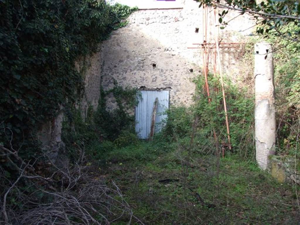 V.2 Pompeii. Casa di Orione. December 2007. Room 11c, looking north across peristyle garden now numbered A19.
The site of the lararium is protected by a corrugated sheet.
The Notizie degli Scavi refers to a passage leading to a second peristyle.
See Notizie degli Scavi di Antichità, 1894, page 439.