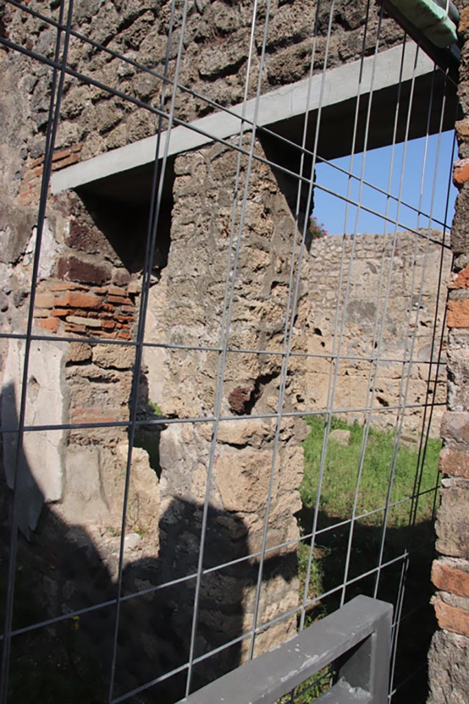 V.3.1 Pompeii. October 2023. East wall with doorway into V.3.2. Photo courtesy of Klaus Heese.