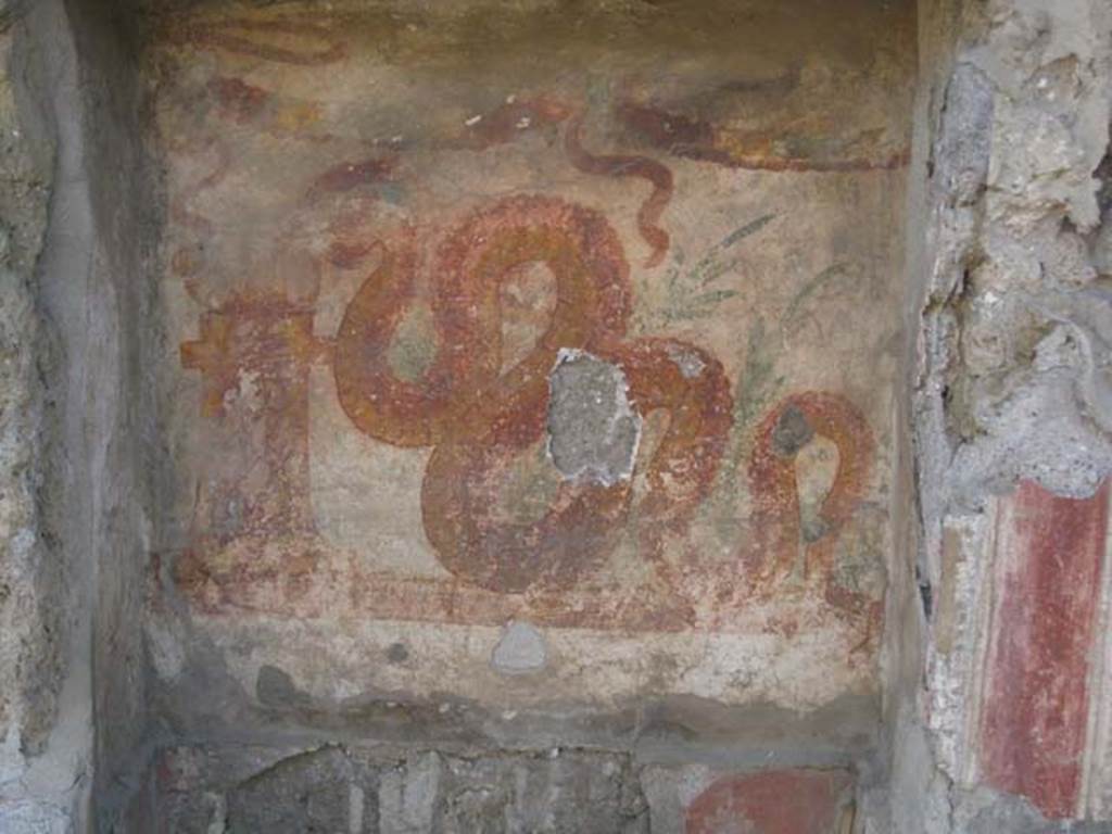 V.3.7 Pompeii. July 2012. Detail of serpent on lararium on west wall of garden area.
Photo courtesy of Sharon M. Wolf.