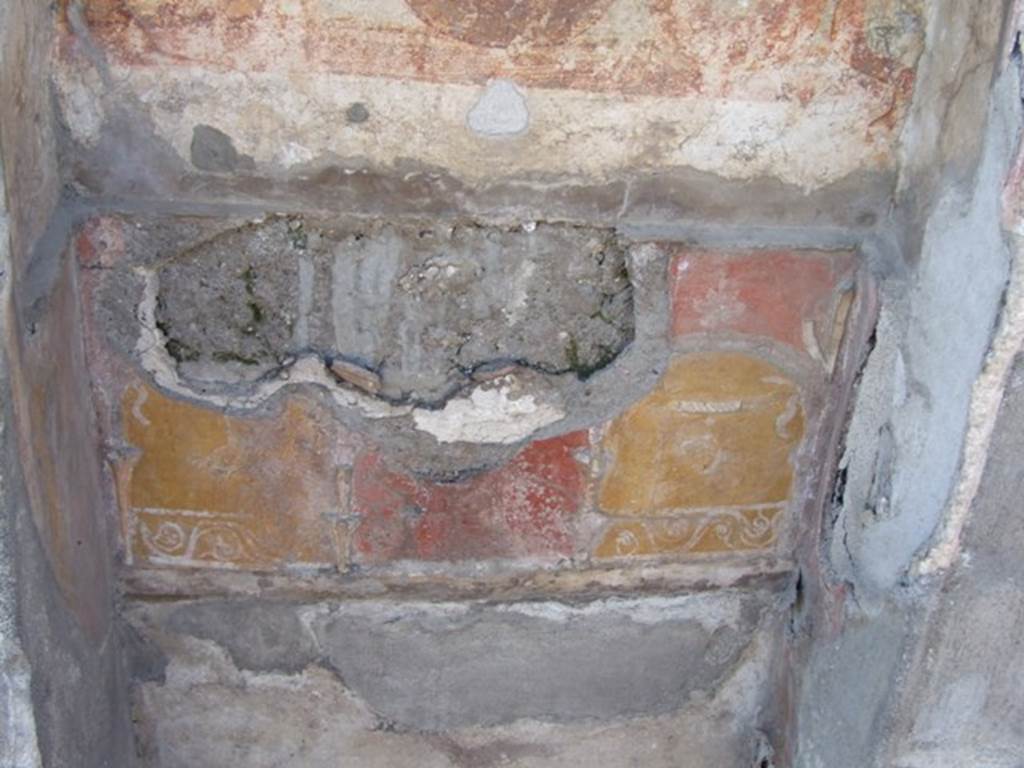 V.3.7 Pompeii. March 2009. West wall of garden area. Lararium lower zone.
The red plaster was painted with an aedicula façade within which stood the painted figure of Ceres.
She was wearing a crown of ears of grain and held a torch in her left hand and a sheaf of grain in her right.
See Boyce G. K., 1937. Corpus of the Lararia of Pompeii. Rome: MAAR 14. (112, p. 38, Pl 36, 2).