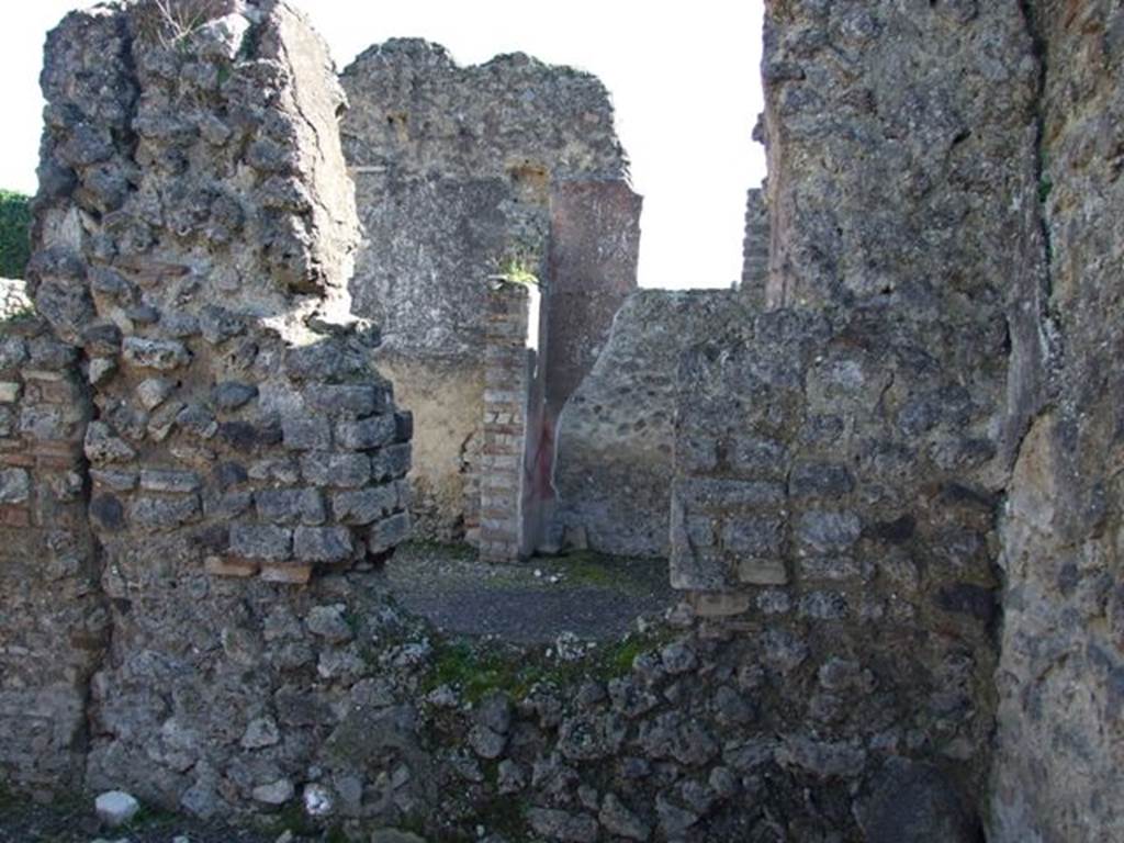 V.3.9 Pompeii. March 2009. Triclinium D, south wall with window. 
Through the window, the south wall of the tablinum converted to a bedroom can be seen.
The window in the south wall of the bedroom would have overlooked into V.3.8.

