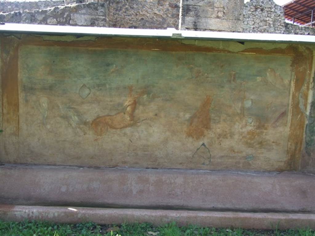 V.5.3 Pompeii. March 2009. Room 7, painting on west side of peristyle � 
Painting 6 - Animal painting showing to the right, a bear standing on his rear legs eating the fruits from a tree. Then to the right, near a bridge, a statue of Priapus near to which was a round altar. On the left, a deer being pursued by a dog. See Not. Scavi, 1899, p.349, number 4.
