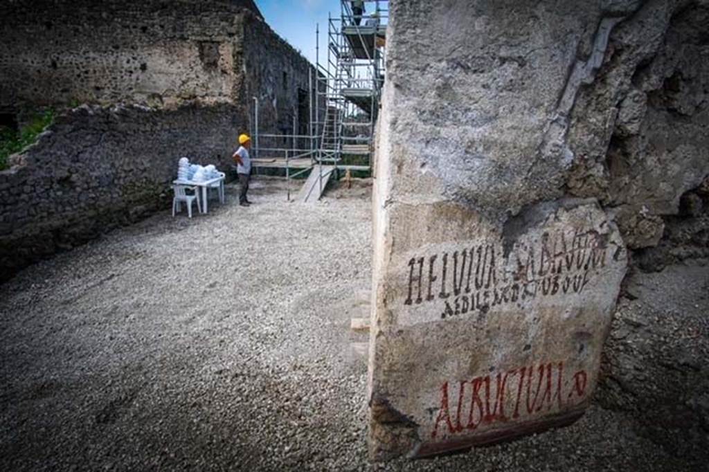 V.7.8 Pompeii. June 2018. Electoral inscriptions on outside east wall around the corner in Vicolo c.d. dei Balconi.
Looking west along new excavated part of Vicolo delle Nozze d�Argento towards V.2.i, from electoral inscriptions.  
Photograph � Parco Archeologico di Pompei.