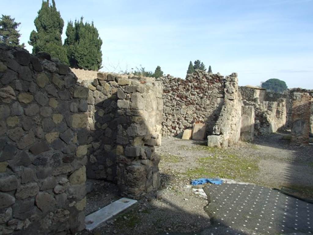 VI.1.7 Pompeii. December 2007. Looking east along north side of atrium, at doorways to rooms 1 and 2.