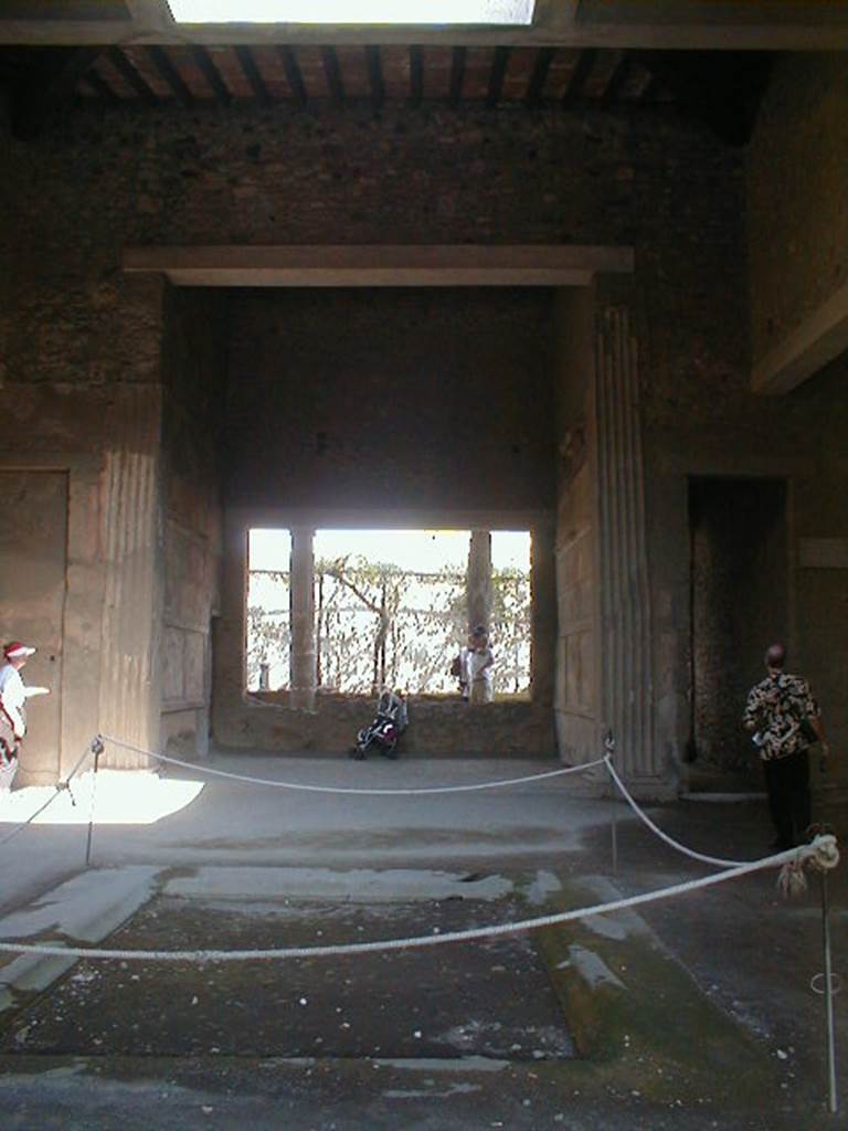 VI.2.4 Pompeii. September 2004. Looking east across atrium and impluvium.
Apart from the west side, the house was entirely destroyed by the bombing during the night of 14/15th September 1943.  According to Laidlaw, the roof, the south apartment, and the portico behind the main house block are almost completely modern reconstructions made in 1970-71. See Garcia y Garcia, L., 2006. Danni di guerra a Pompei. Rome: L’Erma di Bretschneider. (p. 66-74)
