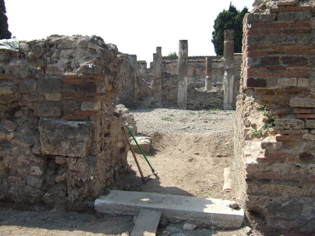 VI.2.19 Pompeii. September 2005. Entrance doorway, looking west.
According to Garcia y Garcia, two bombs fell here that caused the grave ruin and abandonment of the area. The prothyron was destroyed, two rooms to the south of it, and a part of the atrium. The north perimeter wall was also destroyed for a large area of 4 x 4m. See Garcia y Garcia, L., 2006. Danni di guerra a Pompei. Rome: L�Erma di Bretschneider. (p.74)



 
