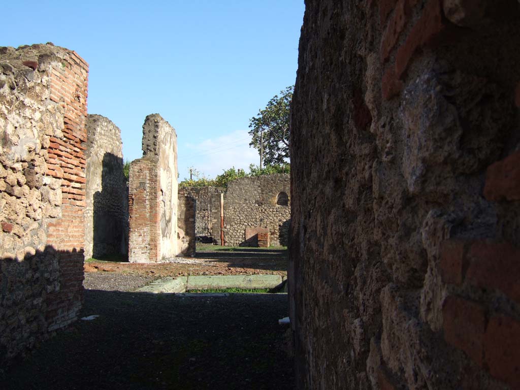 VI.3.7 Pompeii. December 2005. North side of atrium, from entrance corridor.
