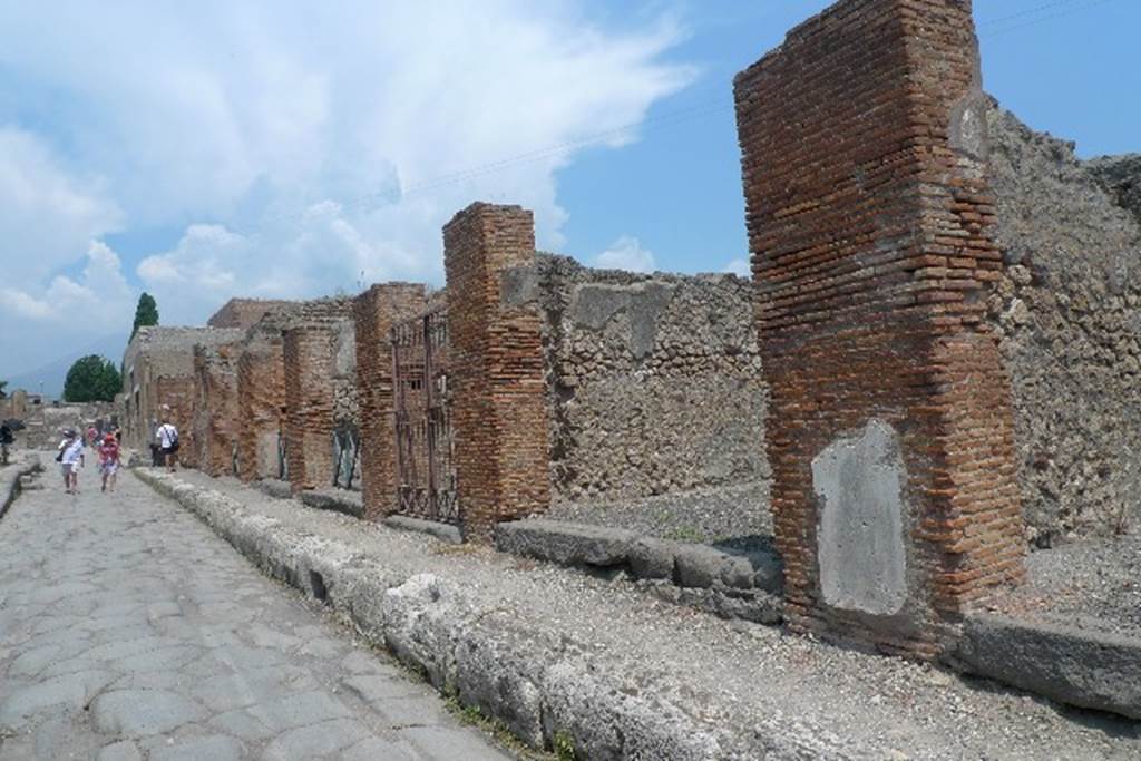 VI.3.8 Pompeii. July 2010. Looking north along east side of Via Consolare from outside VI.3.8. Photo courtesy of Michael Binns.