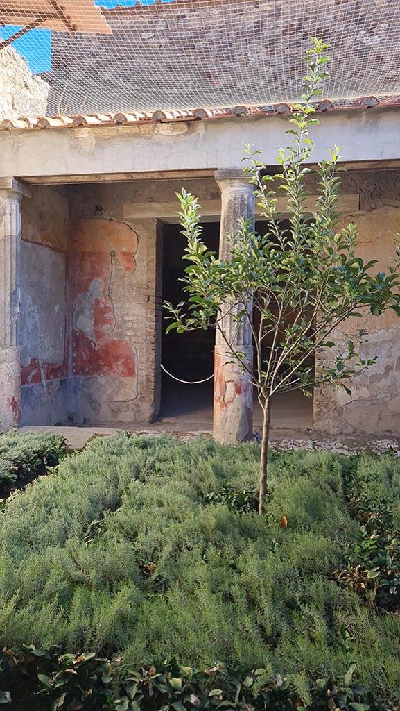 VI.8.3 Pompeii. October 2024. 
Looking east across peristyle towards doorway to room 12. 
Photo courtesy of Giuseppe Ciaramella.

