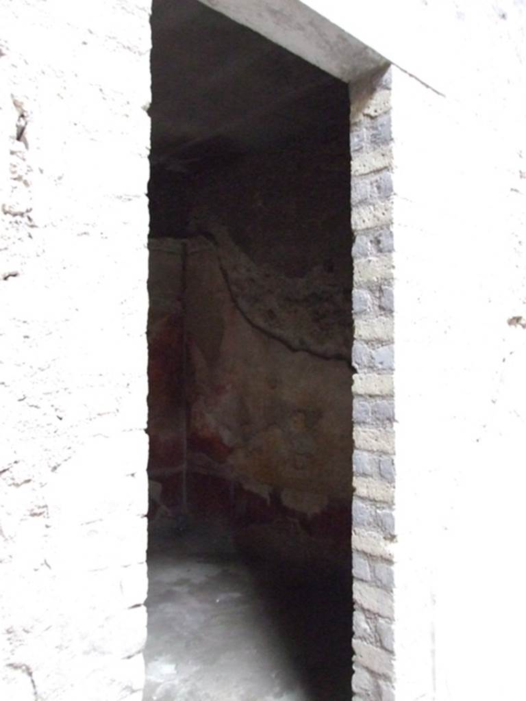 VI.8.5 Pompeii. March 2009. Doorway to room 9, cubiculum. 
According to Bianco in Rivista di Studi Pompeiani, when found this cubiculum was beautifully decorated.
Today the decoration has been totally lost.
The lower walls would have had a dark red dado (zoccolo).
The walls were divided into red and yellow panels, the middle panel on each wall was yellow.
In the central yellow panel were mythological paintings.
Apollo and Daphne on the north wall.
Europa on the Bull on the south wall.
Phryxus and Helle on the west wall.
On the east wall was the doorway to the atrium.
On high was a frieze showing Amazons, this was interrupted in the centre of the west wall with a painting of Venus Pompeiana.
See Bianco, A. Il fregio delle Amazzoni nella Casa del Poeta Tragico a Pompei: Rivista di Studi, XVIII, 2007, Roma: L�erma di Bretschneider, p.54-66 with photos.
See Bragantini, de Vos, Badoni, 1983. Pitture e Pavimenti di Pompei, Parte 2. Rome: ICCD. (p.173, room numbered as cubiculum 6a).
