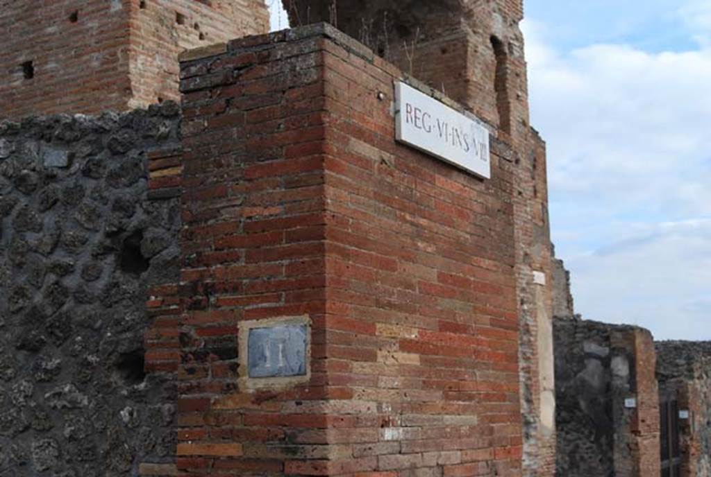 VI.8.11 Pompeii.  November 2009. Pilaster on east side of entrance doorway. Photo courtesy of Nicolas Monteix.