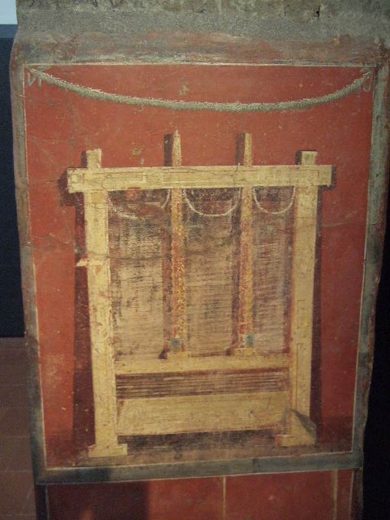 Pillar found in the Fullonica at VI.8.20.   Painting of fuller�s press for drying the wet cloths.  Now in Naples Archaeological Museum.  Inventory number 9974.