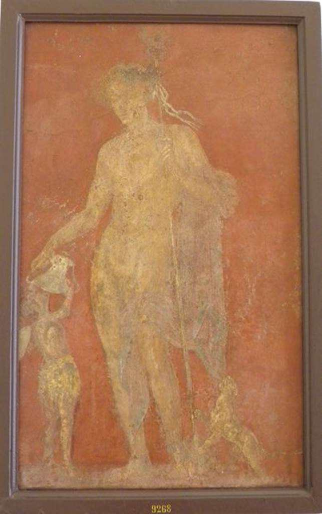 VI.9.6 Pompeii.  Found on 1st July 1828.  Wall painting of Dionysus or Bacchus with panther to his left and a Cantharus in his right hand from which a satyr is drinking.   One of various painted figures found on the walls of the atrium. See Helbig, W., 1868. Wandgem�lde der vom Vesuv versch�tteten St�dte Campaniens. Leipzig: Breitkopf und H�rtel. (400). Now in Naples Archaeological Museum.  Inventory number 9268.