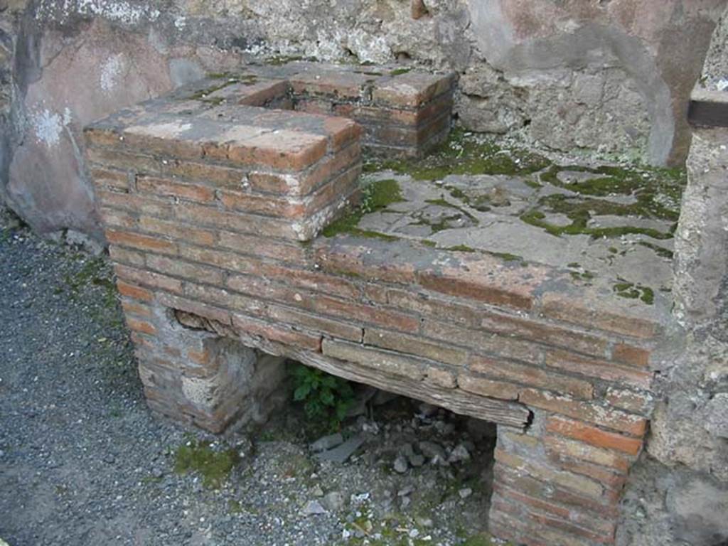 VI.10.1 Pompeii. May 2003. Hearth on south side of bar-room. Photo courtesy of Nicolas Monteix.