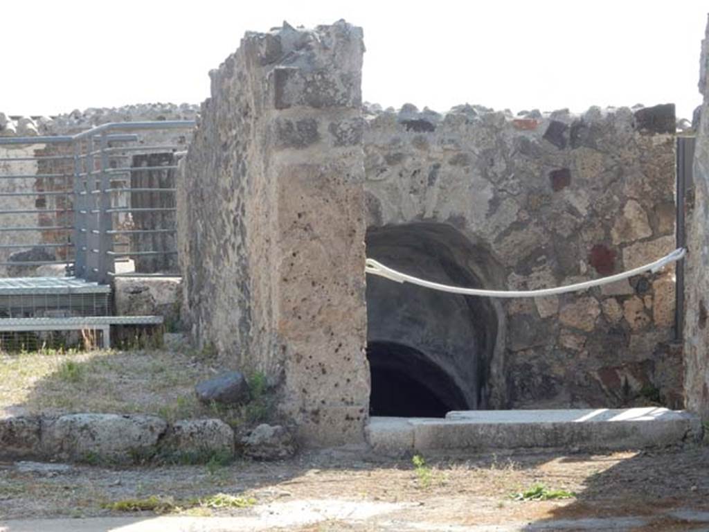 VI.10.7 Pompeii. May 2017. 
Looking east across atrium towards south side of tablinum, on left, and stairs to lower level, on right. Photo courtesy of Buzz Ferebee.

