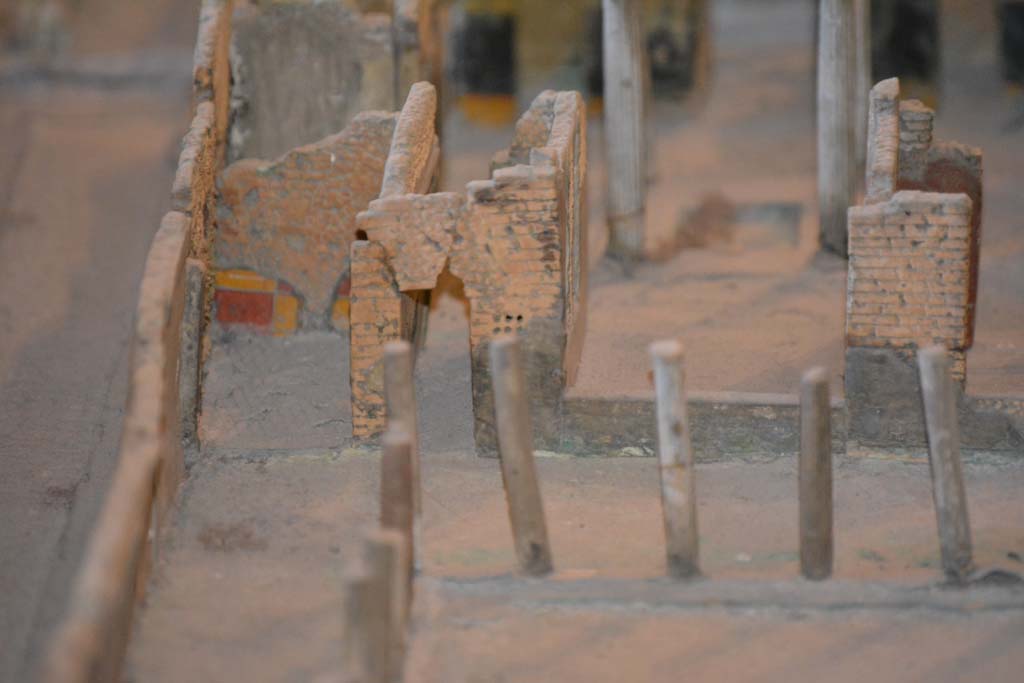 VI.11.9/10 Pompeii. July 2017. 
South-east corner of Peristyle 36, with doorway to room 37, on left, to corridor 34, in centre, and window into tablinum 33, centre right.
From cork model in Naples Archaeological Museum.
Foto Annette Haug, ERC Grant 681269 D�COR.
