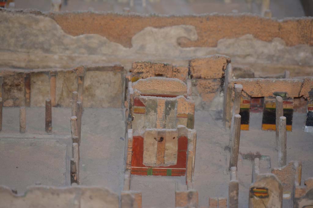 VI.11.9/10 Pompeii. July 2017. In centre, painted east wall of room 35, with east wall of tablinum 33, at its rear.
From cork model in Naples Archaeological Museum.
Foto Annette Haug, ERC Grant 681269 D�COR.
