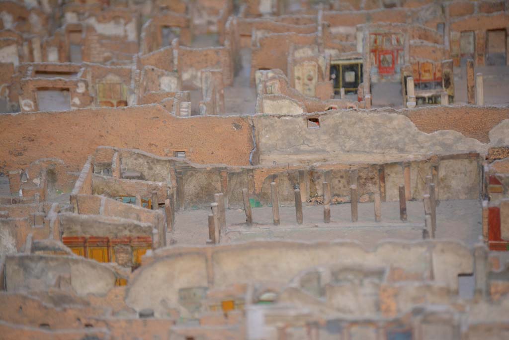 VI.11.9/10 Pompeii. July 2017. 
Looking towards east wall of peristyle 36, with east walls of rooms 40, (yellow painted, lower left), 42, 43 and 46, visible on left.
From cork model in Naples Archaeological Museum.
Foto Annette Haug, ERC Grant 681269 D�COR.
