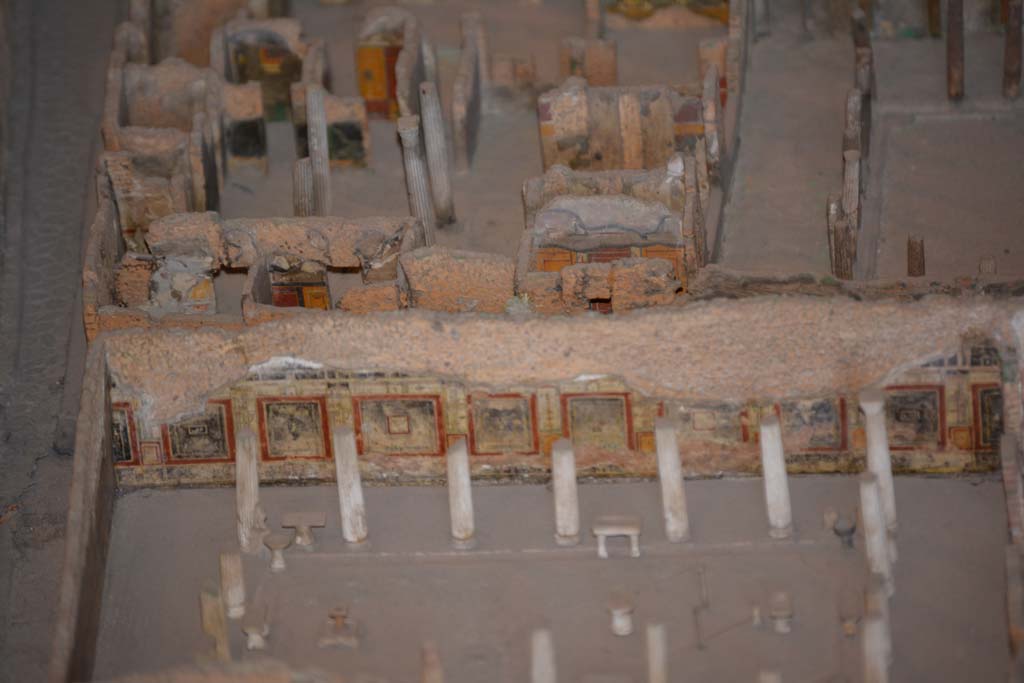 VI.11.9/10 Pompeii. July 2017. Looking west.
Across the centre, on the east side of atrium 27, the west wall of rooms 26, and the red/black west wall of room 30 can be seen.
From cork model in Naples Archaeological Museum.
The lower west wall and peristyle belong to VI.15.1, thr House of Vettii.
Foto Annette Haug, ERC Grant 681269 D�COR.

