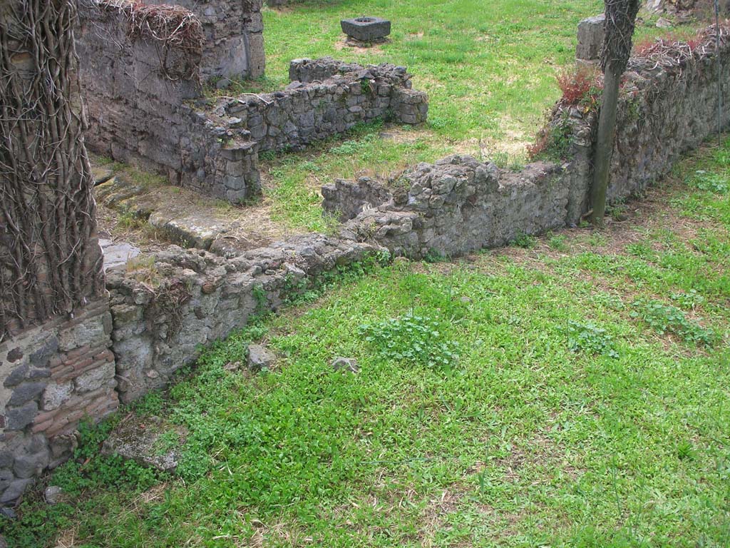 VI.11.20 Pompeii, Pompeii. May 2010. 
Looking towards entrance doorway on west side of Vicolo del Labirinto, from Tower X. Photo courtesy of Ivo van der Graaff.
