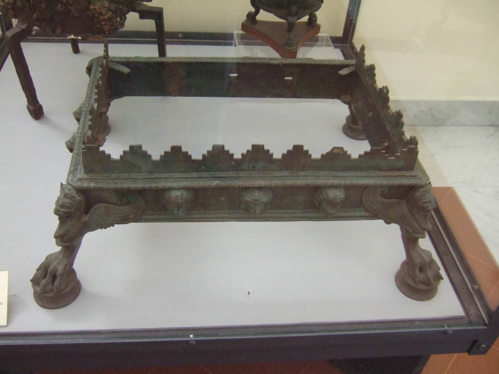 VI.12.2 or VII.9.20 Pompeii. Bronze brazier found in VI.12.2, according to card in Naples Museum. 
Now in Naples Archaeological Museum. Inventory number 72991. 
According to Pagano and Prisciandaro, this was found in VII.9.20, a shop, on 25th May 1822.
See Pagano, M. and Prisciandaro, R., 2006. Studio sulle provenienze degli oggetti rinvenuti negli scavi borbonici del regno di Napoli. Naples: Nicola Longobardi, (p. 124). 
See Fiorelli G., 1862. Pompeianarum antiquitatum historia, Vol. 2: 1819 - 1860, Naples, p. 52-53
