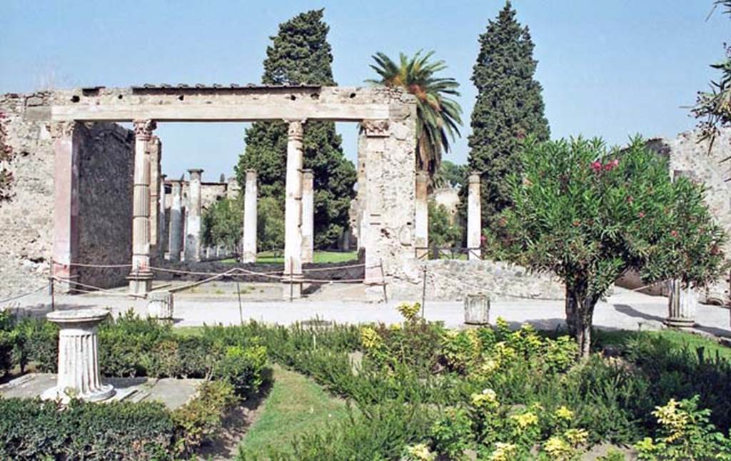 VI.12.2 Pompeii. October 2001. Looking north from middle peristyle garden towards exedra, and through to rear peristyle. Photo courtesy of Peter Woods.
