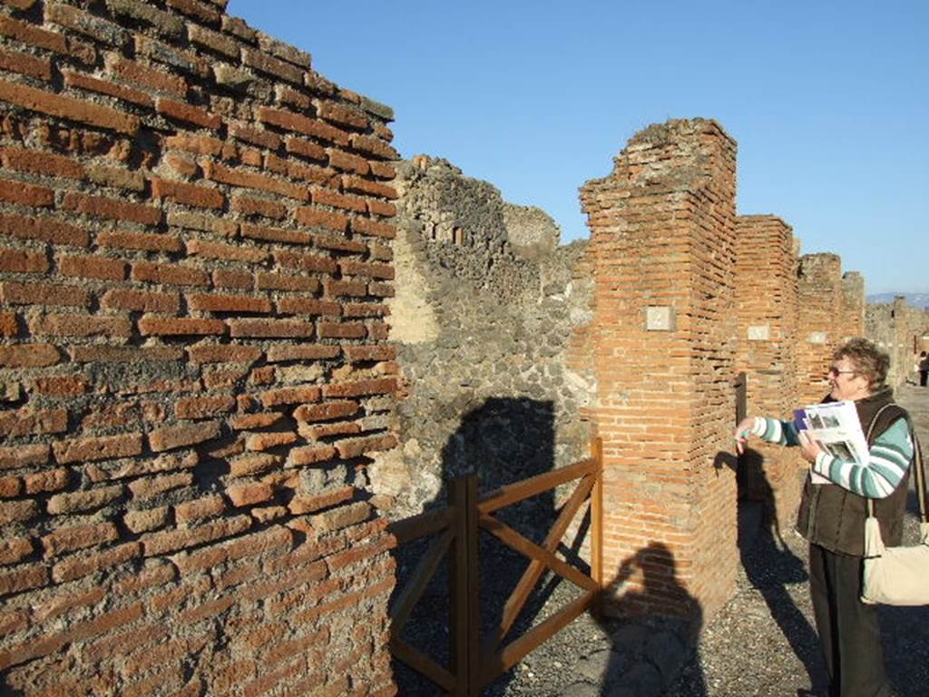 VI.14.4 Pompeii. December 2006. Entrance doorway, looking east along Via della Fortuna.