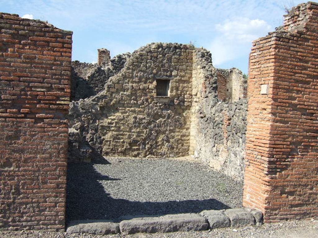 VI.14.4 Pompeii. December 2006. Entrance, looking towards north-east corner of shop.