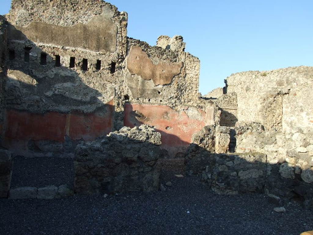 VI.14.8 Pompeii. December 2006. Doorway to small room on right side, with stairs to upper floor ? According to Helbig, visible in the second rear room on the left was an unclear painting. See Helbig, W., 1868. Wandgem�lde der vom Vesuv versch�tteten St�dte Campaniens. Leipzig: Breitkopf und H�rtel. (1387b).  According to Fiorelli, the painting perhaps showed two litigants in the presence of a magistrate? See Pappalardo, U., 2001. La Descrizione di Pompei per Giuseppe Fiorelli (1875). Napoli: Massa Editore. (p.157).  According to Eschebach, this may also have been known as the �Casetta dei Litiganti�, presumably named from the painting.  See Eschebach, L., 1993. Geb�udeverzeichnis und Stadtplan der antiken Stadt Pompeji. K�ln: B�hlau. (p.209)
