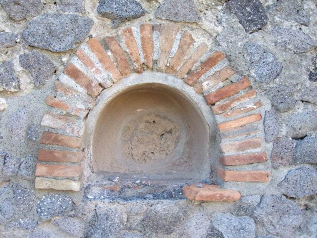 VI.14.16 Pompeii. December 2007. Niche in west wall. According to Boyce, in the west wall of the main room was an arched niche. See Boyce G. K., 1937. Corpus of the Lararia of Pompeii. Rome: MAAR 14. (p.52, no. 198)

